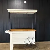The white bar, food or gift cart with a butcher-block top and canopy