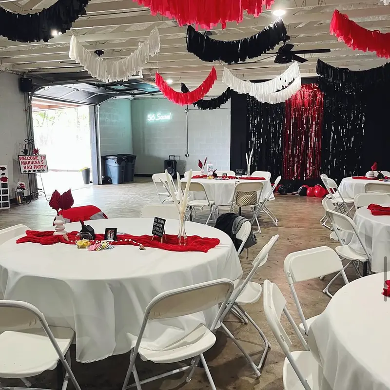 Red, black and white streamers across the ceiling for a graduation party
