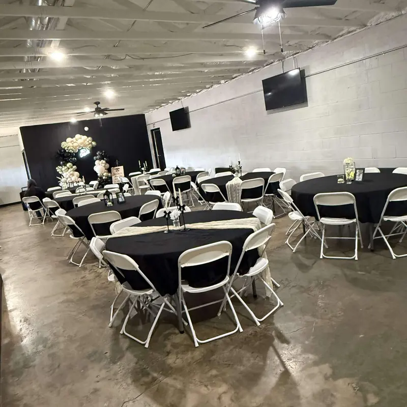 Black linens with cream runners and white chairs